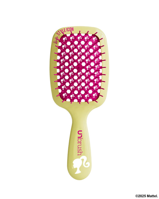 Yellow hairbrush with pink bristle pattern on a white background