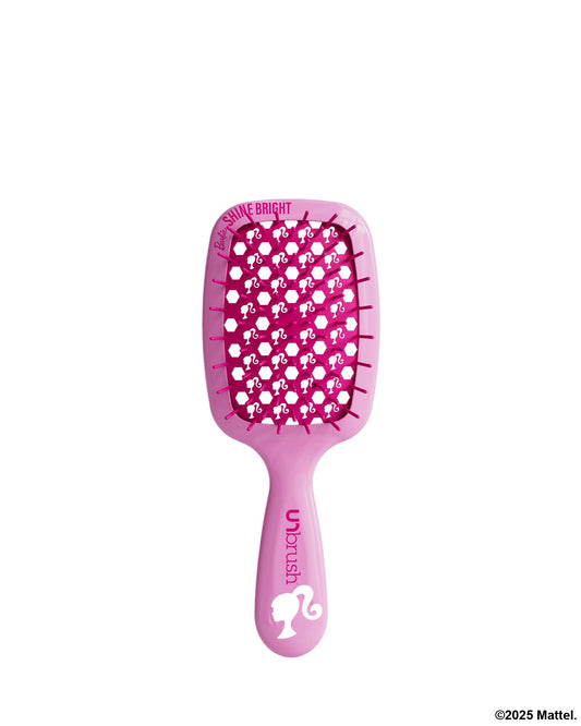Pink hairbrush with character design on a white background