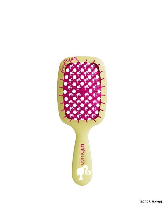 Green hairbrush with pink bristle pattern on a white background