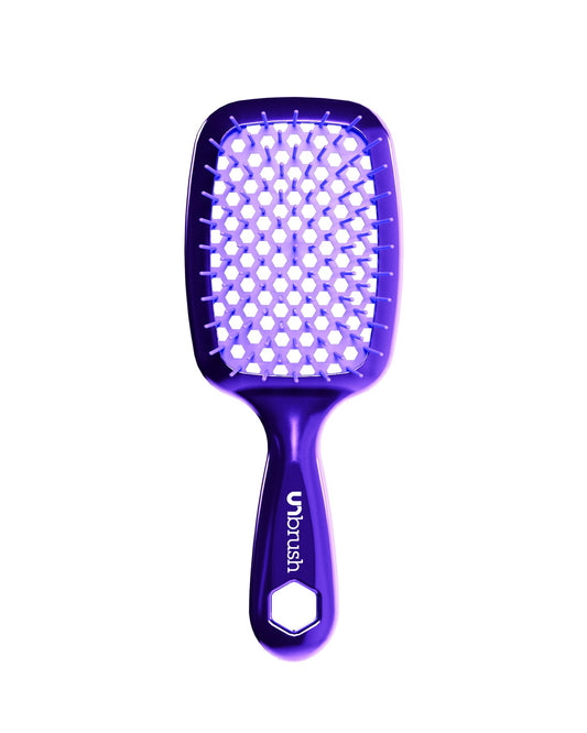 Purple chrome hairbrush with a white bristle head on a white background