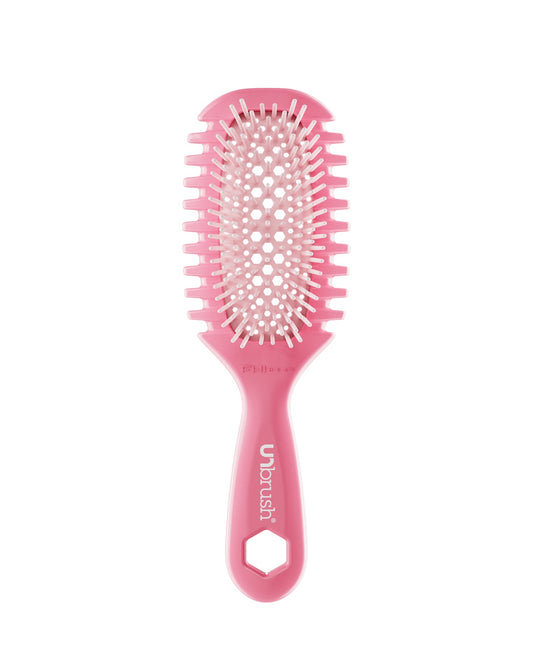 Pink hairbrush on a white background