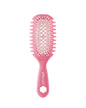 Pink hairbrush on a white background