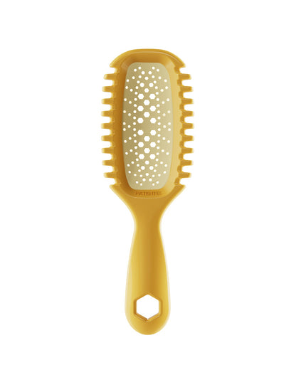 Yellow pet grooming brush with a textured handle on a white background