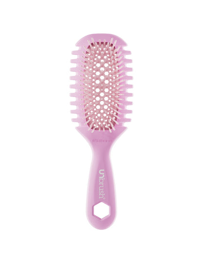 Pink hairbrush on a white background