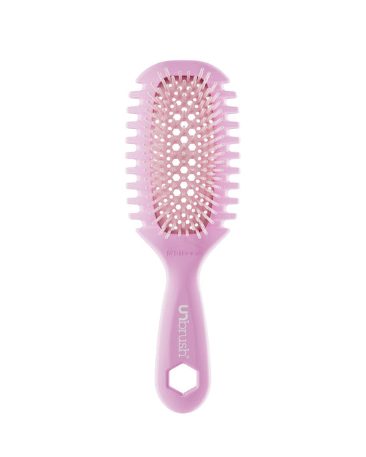 Pink hairbrush on a white background