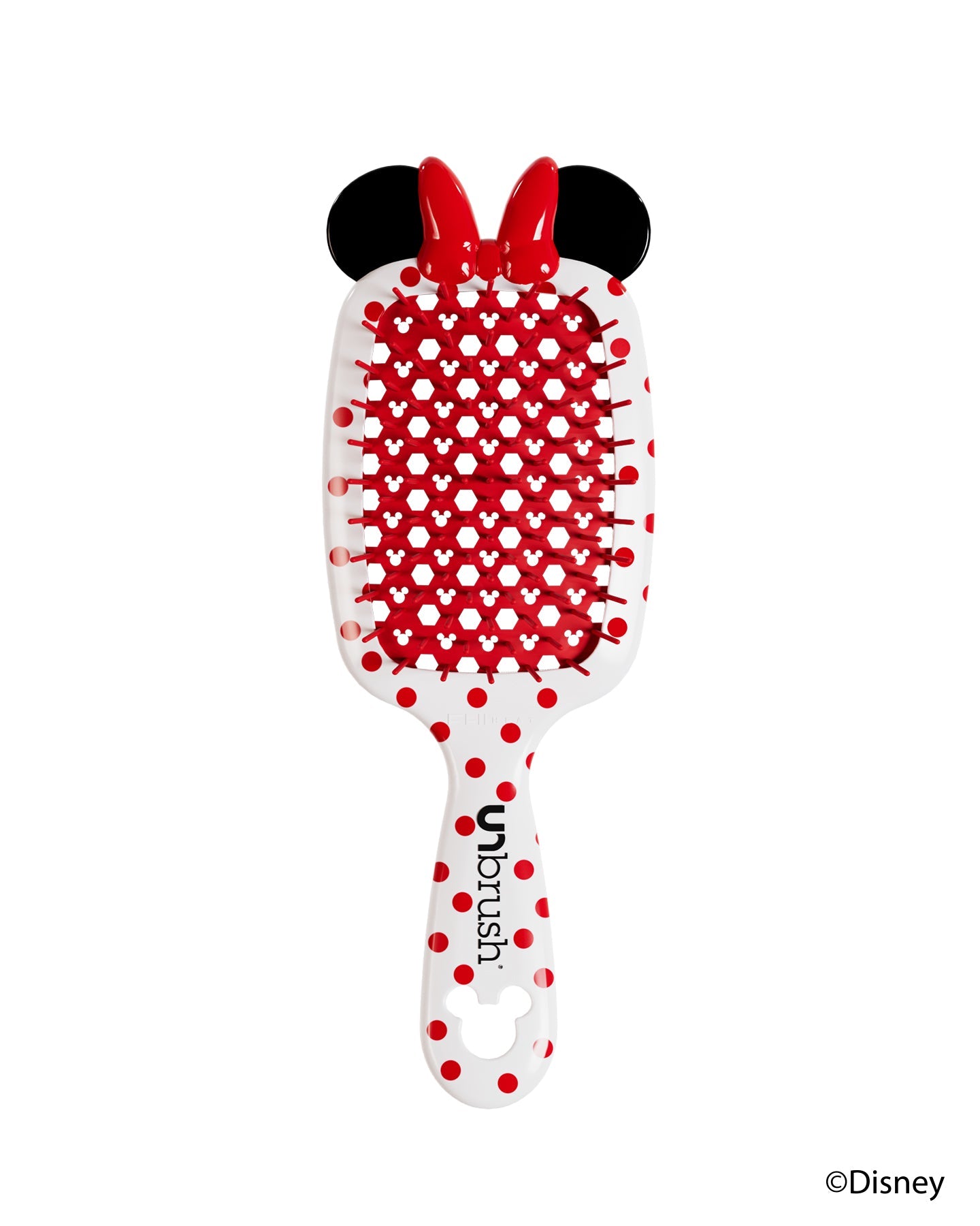 Front view of a white Minnie Mouse-themed UNbrush with red polka dots, red bow, and Mickey head pattern on the brush pad.