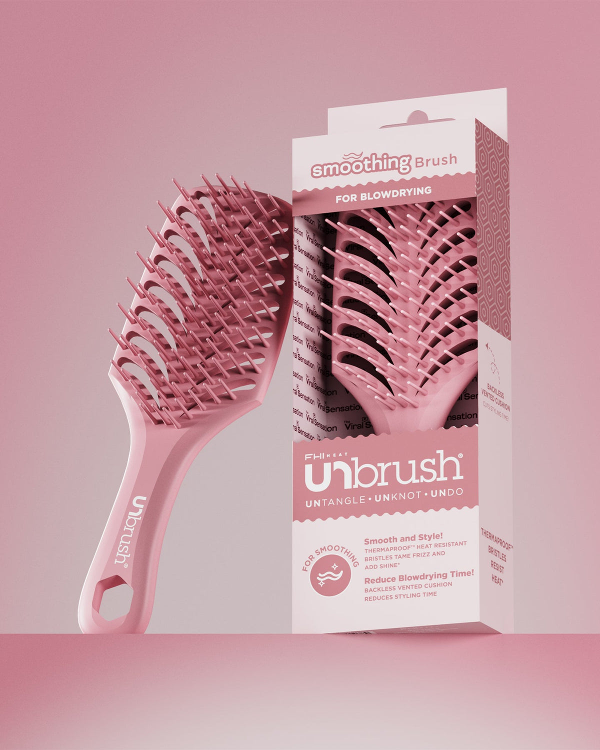Pink smoothing brush with packaging on a pink background